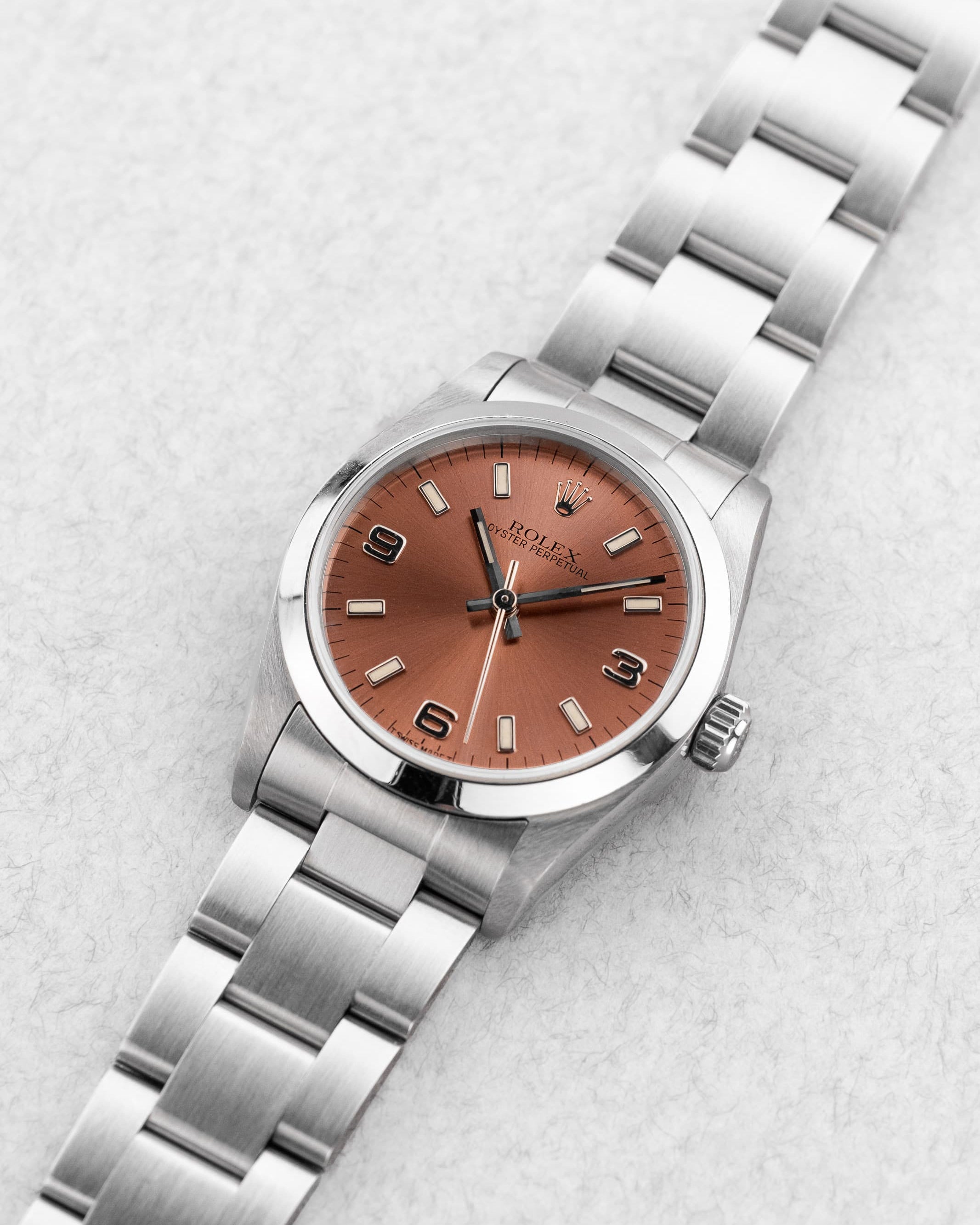 VN4D Rolex Oyster Perpetual 31 réf. 67480 de 1997-1998 – Cadran rose/saumon « Explorer 3-6-9 » - Three Quarters