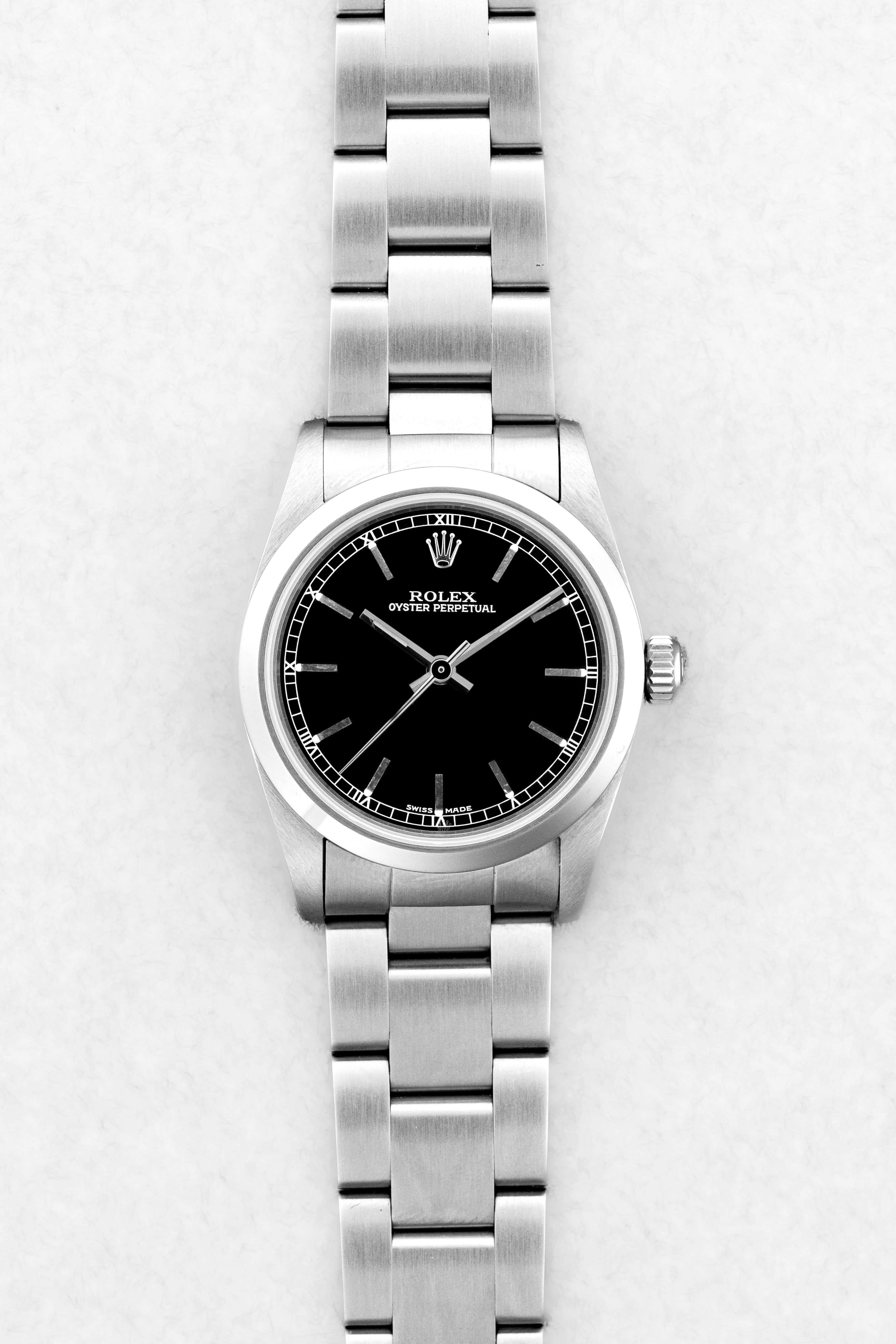 MY8S Rolex Oyster Perpetual 31 réf. 77080 de 2002 – Cadran noir à index bâtons + Full Set - Front