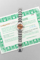 SUK2 Rolex Oyster Perpetual 31 réf. 67480 de 1997-1998 – Garantie Rolex d’origine + Cadran rose/saumon « Explorer 3-6-9 » - Papers