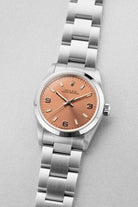 SUK2 Rolex Oyster Perpetual 31 réf. 67480 de 1997-1998 – Garantie Rolex d’origine + Cadran rose/saumon « Explorer 3-6-9 » - Three Quarters